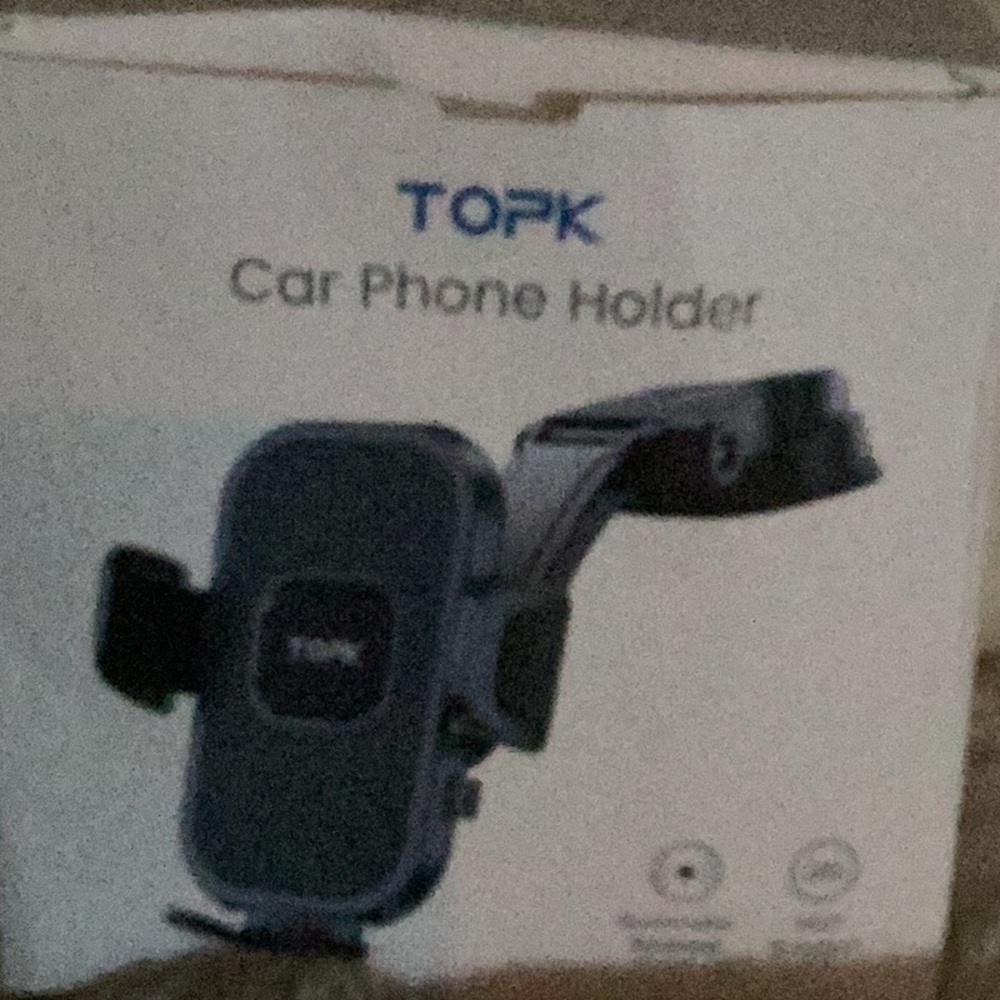 TOPK car phone holder complete with instructions and all the pieces. Brand new